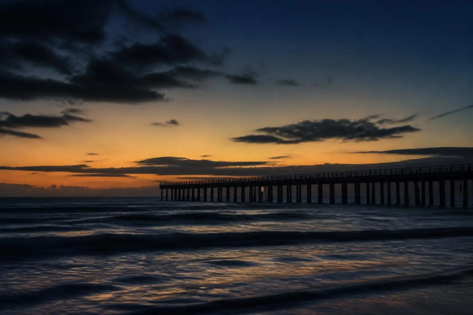 Pier silhouette at sunset